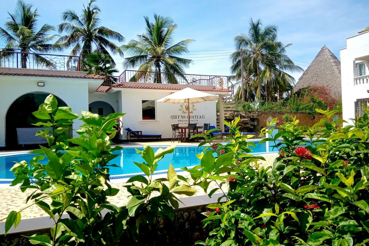 Swimming pool surrounded by tropical greenery