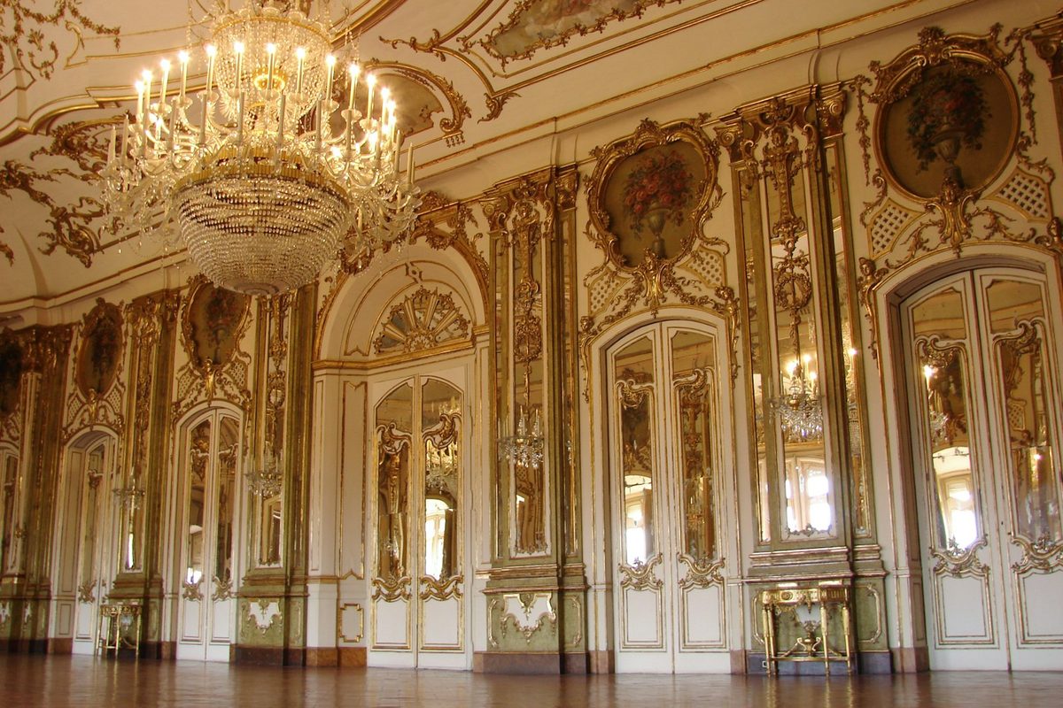 Lighted chandelier inside white and brown building
