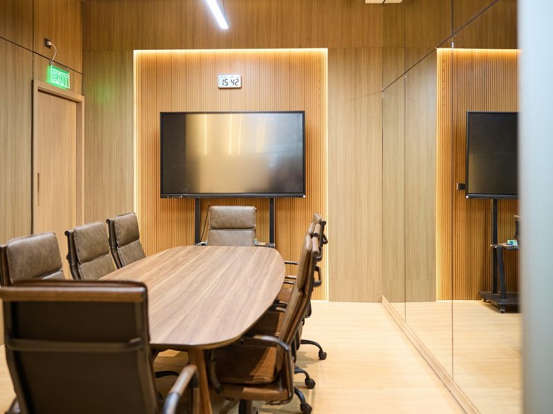 Modern conference room with oval table and chairs