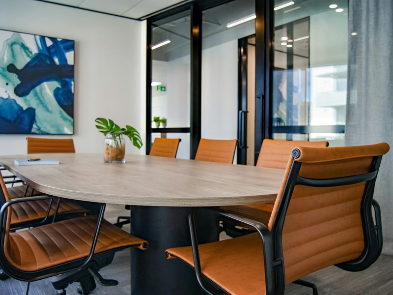 Brown wooden 9-piece office table and chairs