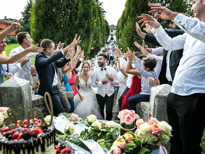 People standing and sitting on chair during daytime