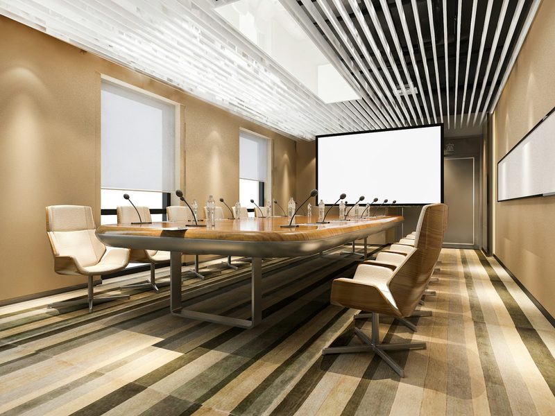 Modern conference room with long table and chairs